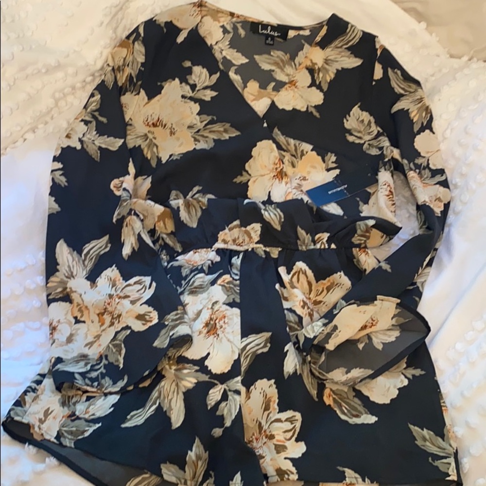 Long sleeved blue floral romper.